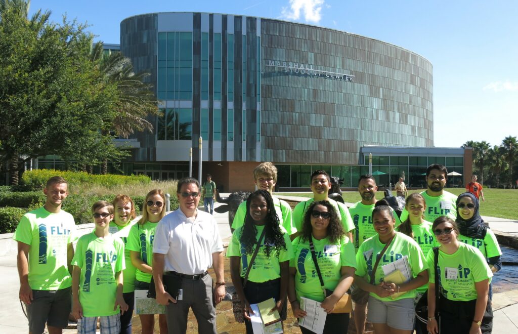 Group of diverse flip students posing for photo at USF Marshall Center