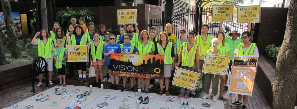 vision zero advocates holding signs