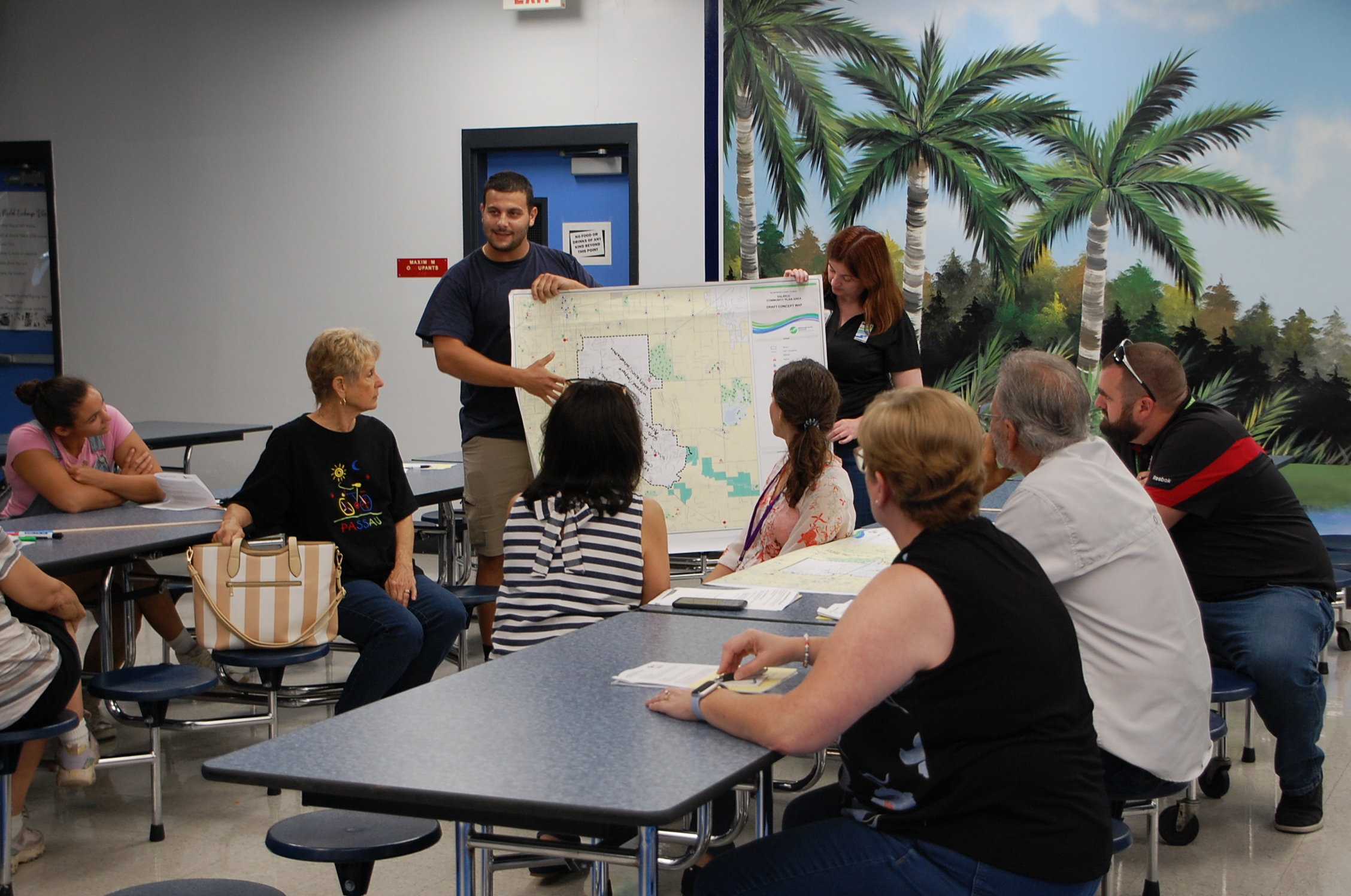 Community members presenting their map of Valrico to other people at a public meeting.