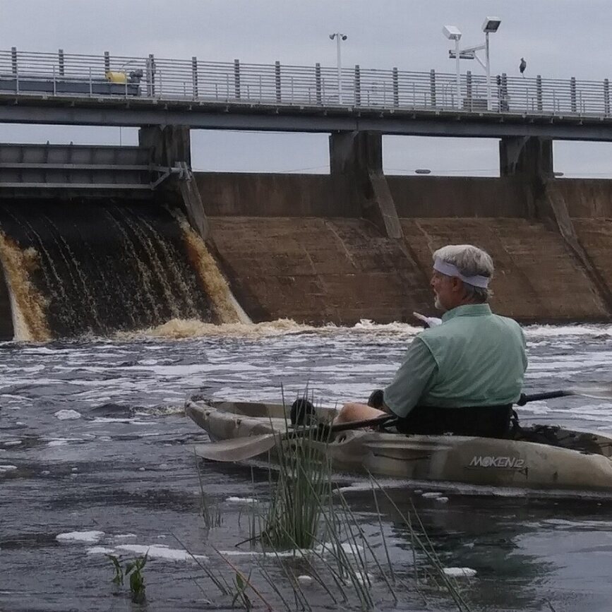 Dr. Richard Brown in a kayak on the Hillsborough River surveying the water flow from the City of Tampa dam